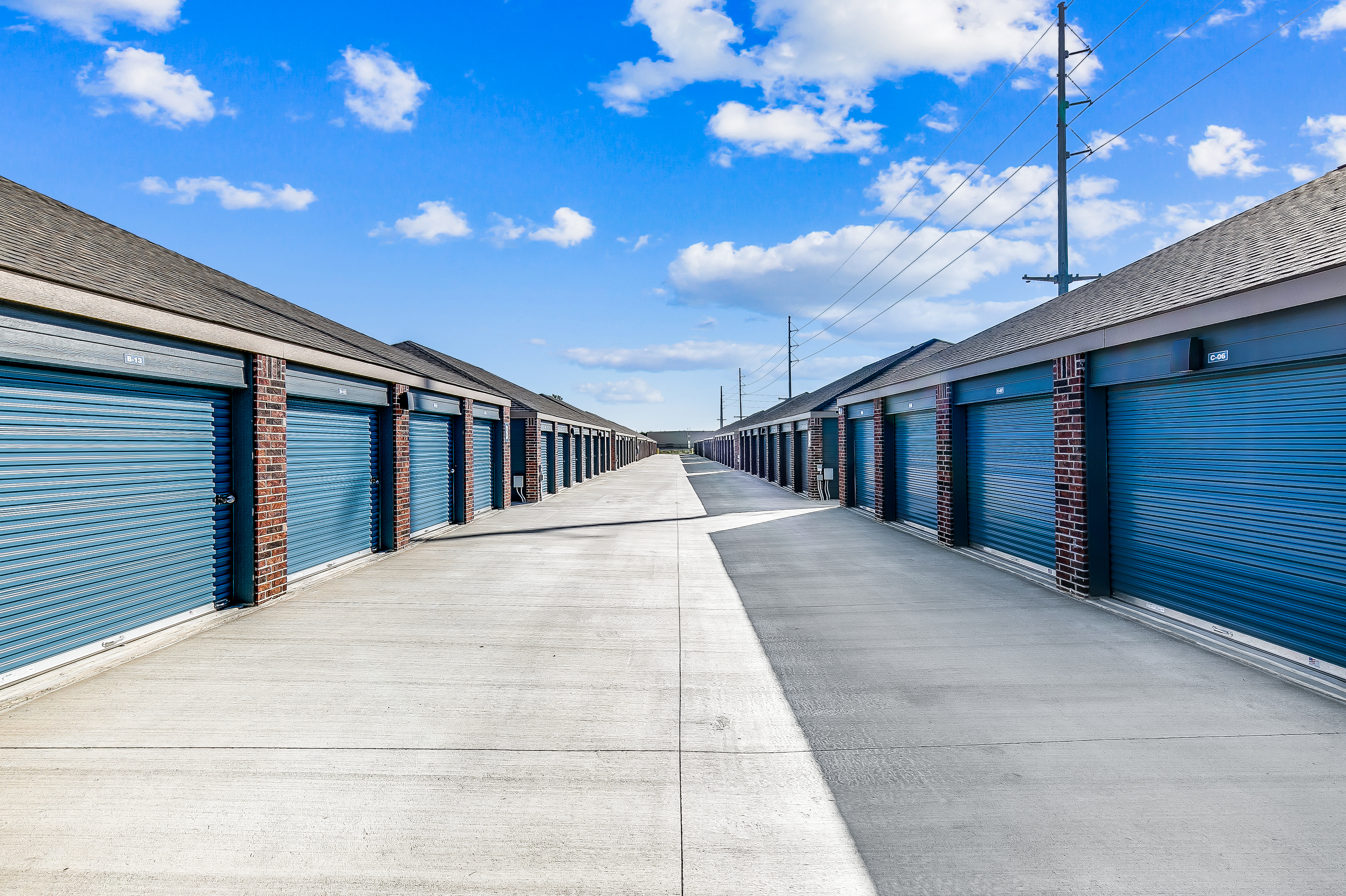 Looking down a drive with self storage units doors